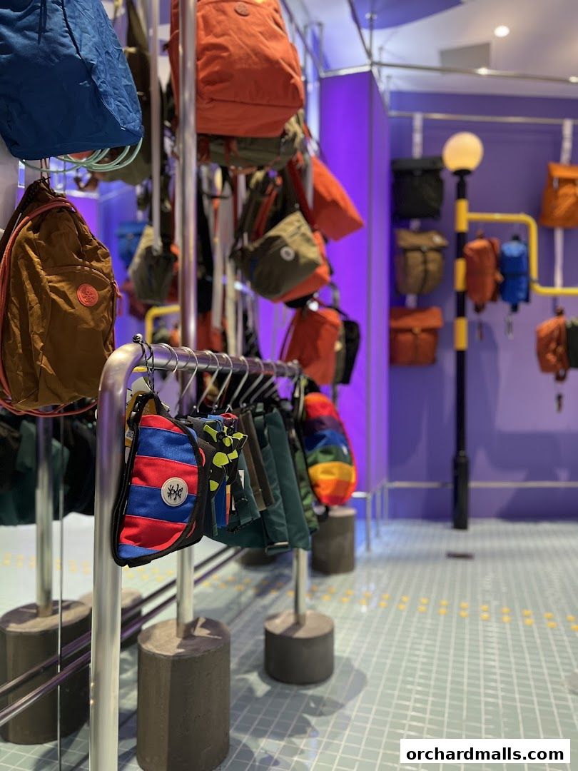 A colorful display of bags and accessories inside a retail store.