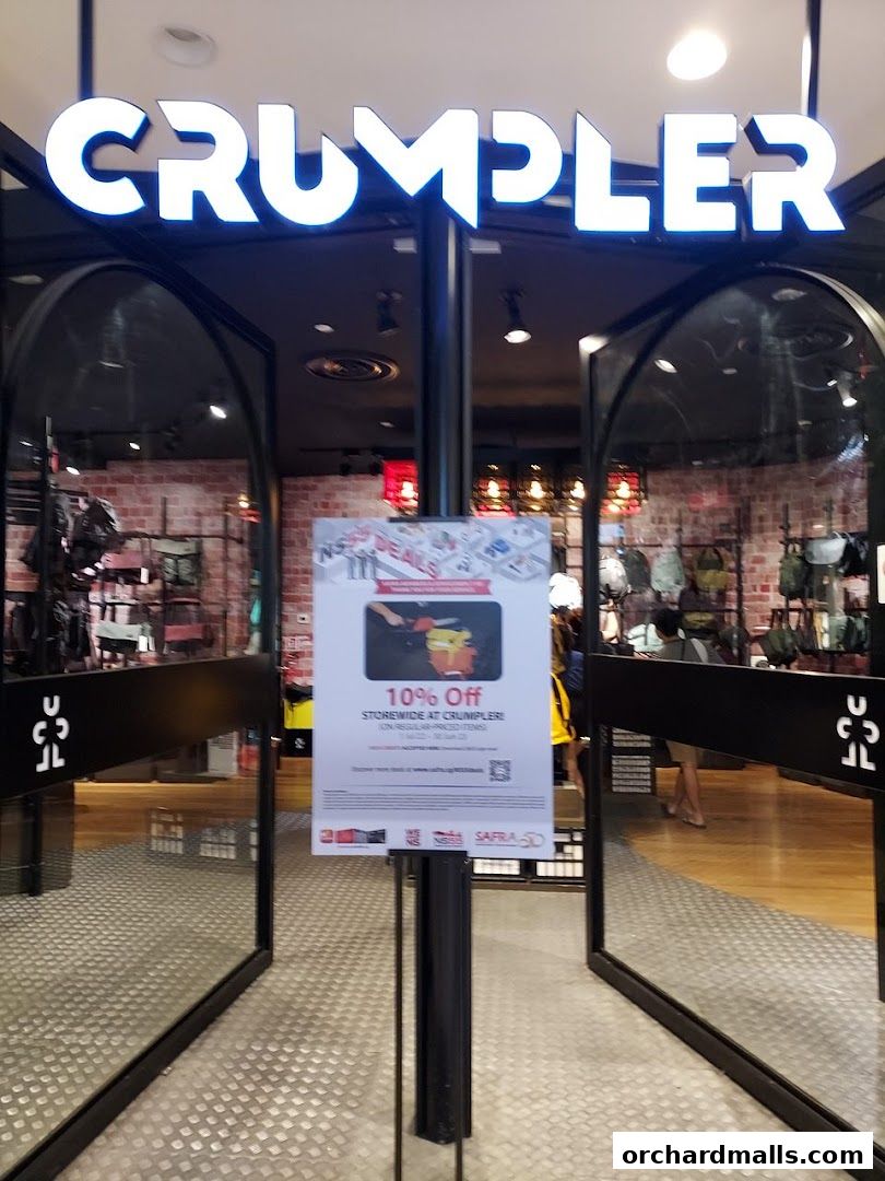 The entrance to a Crumpler store with a 10% off storewide promotion sign.
