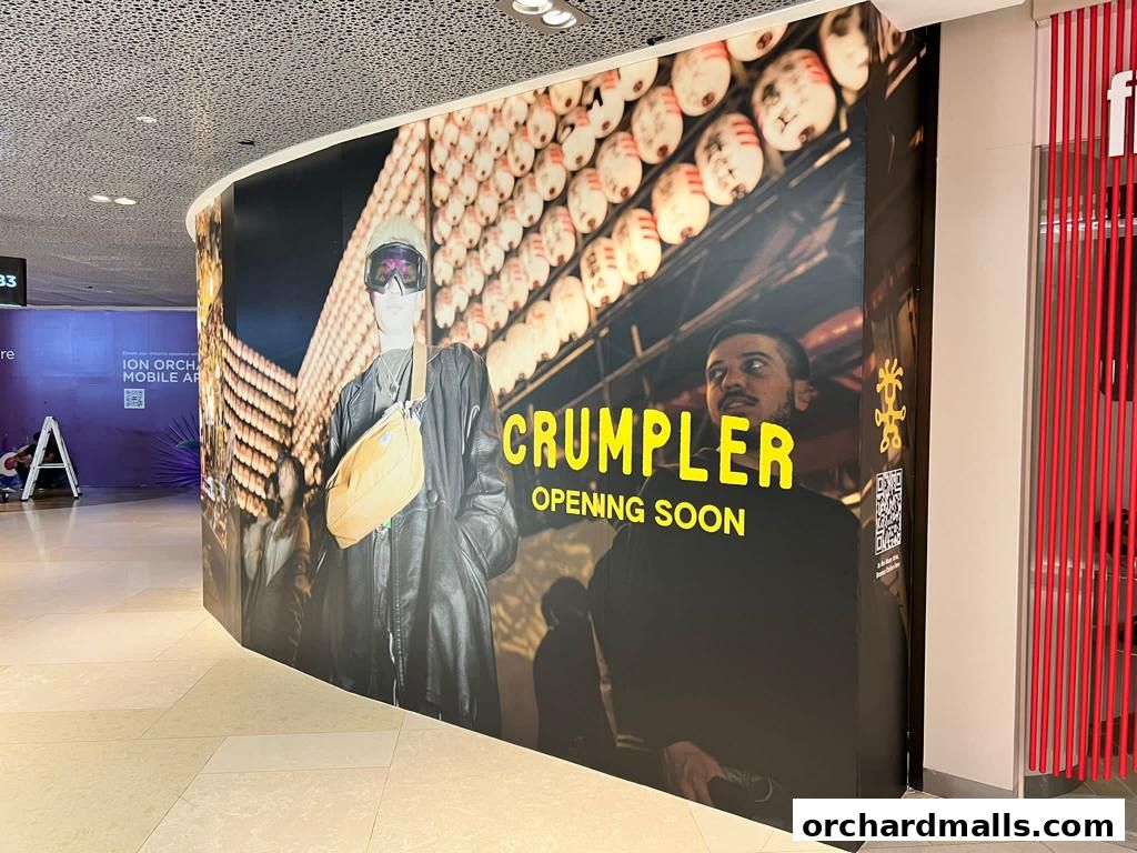 A large banner announcing the upcoming opening of the Crumpler store.