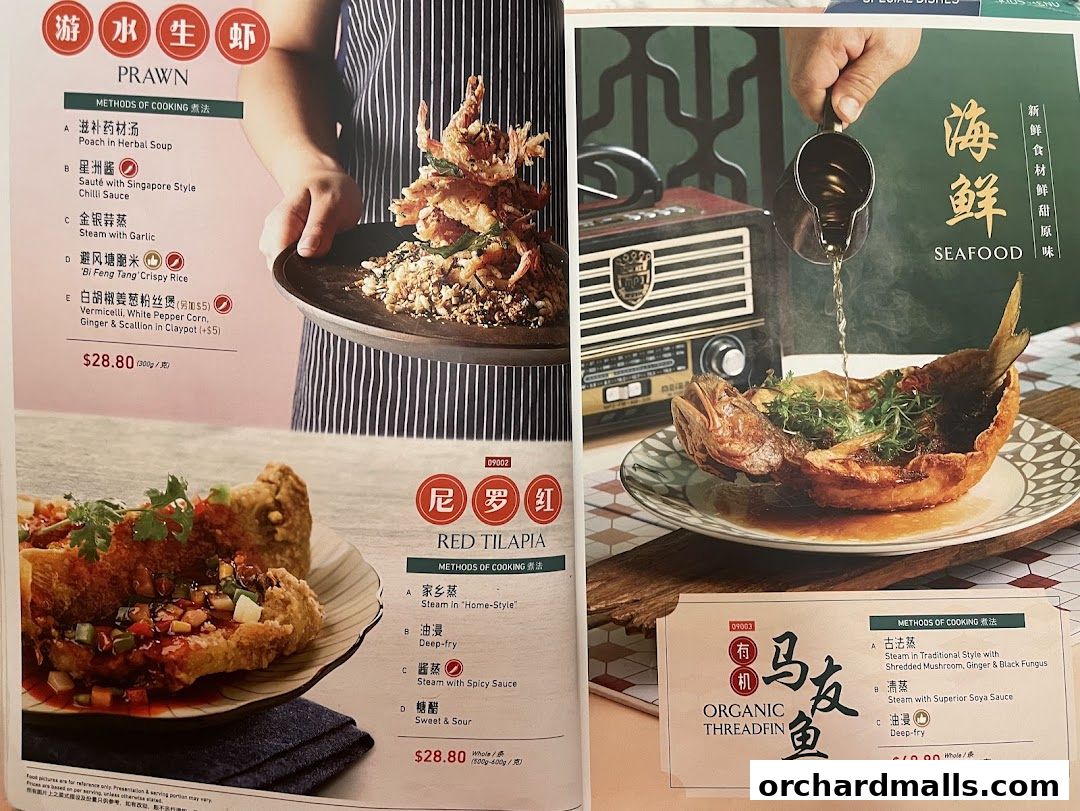A menu from Crystal Jade Hong Kong Kitchen showcasing seafood dishes like prawns and fish.