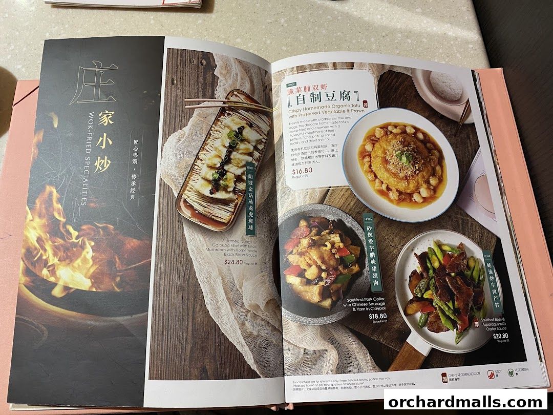 A menu from Crystal Jade Hong Kong Kitchen showcasing wok-fried specialties with enticing food photography.