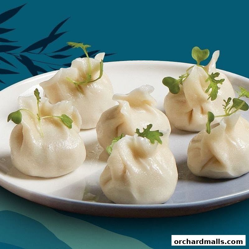 A plate of delicate steamed dumplings garnished with fresh greens.