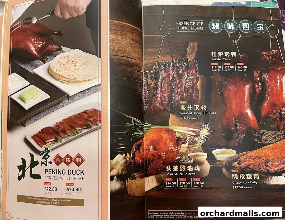 A menu showcasing various roasted meats including Peking Duck, Roasted Duck, and Crispy Pork Belly.