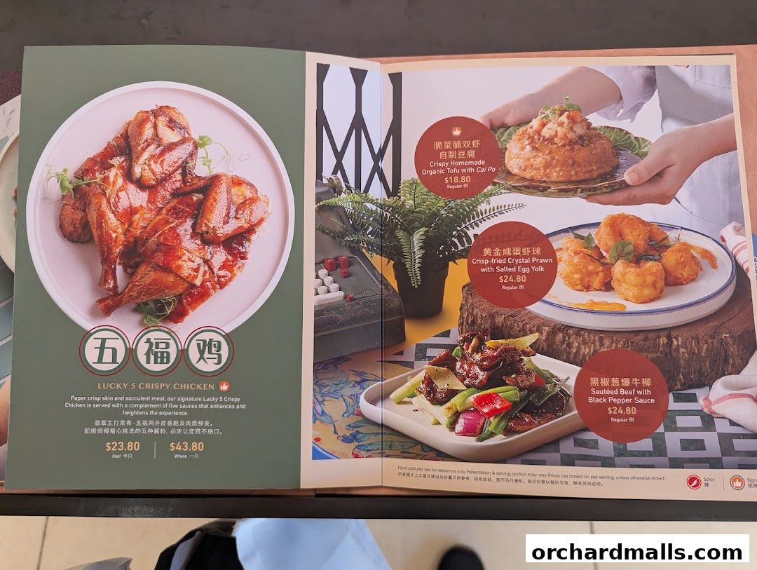 A menu spread showcasing crispy chicken, tofu, prawns, and beef dishes from Crystal Jade Hong Kong Kitchen.