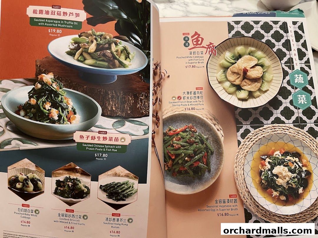 A menu from Crystal Jade Hong Kong Kitchen showcasing various vegetable dishes with prices.