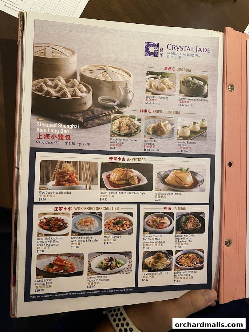 A menu from Crystal Jade Hong Kong Kitchen featuring dim sum, appetizers, and noodle dishes.