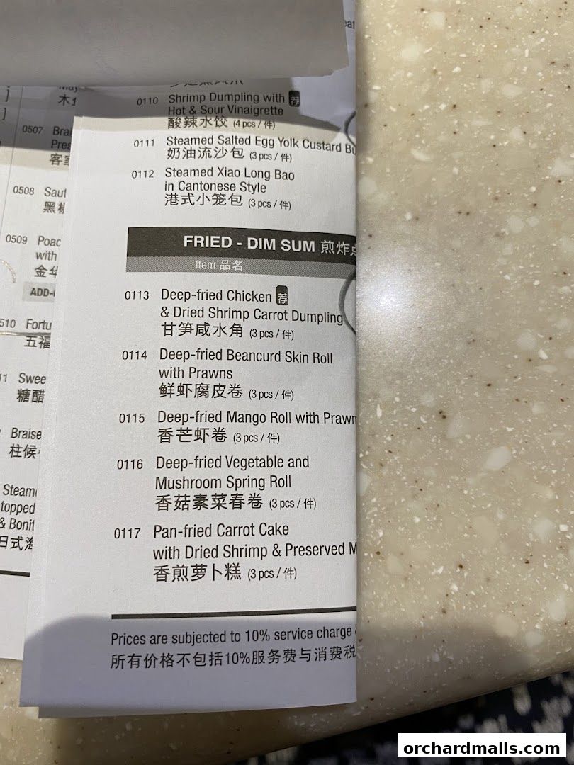 A close-up of a menu from Crystal Jade Hong Kong Kitchen, featuring fried dim sum items.