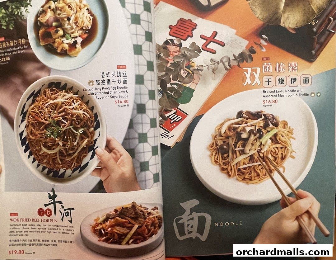 A menu page showcasing various noodle and wok-fried dishes from Crystal Jade Hong Kong Kitchen.