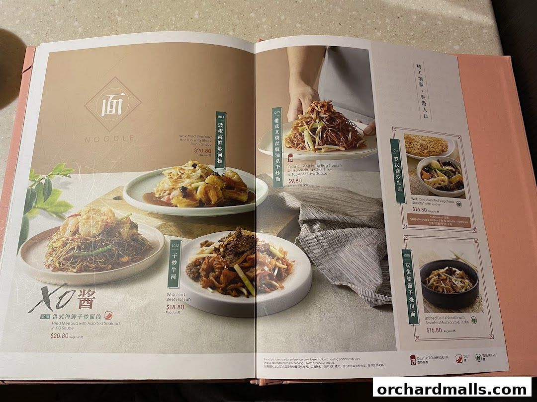 A menu page from Crystal Jade Hong Kong Kitchen showcasing various noodle dishes.