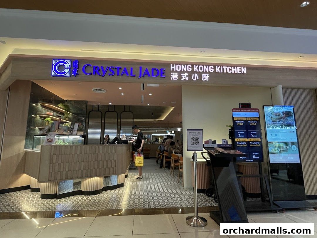 The entrance of Crystal Jade Hong Kong Kitchen restaurant with a waiting queue display.