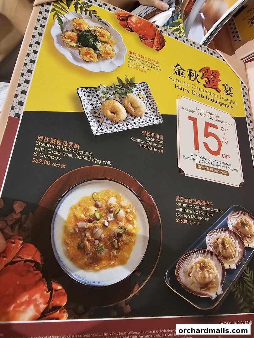 A menu featuring autumn crustacean delights with various crab and scallop dishes.