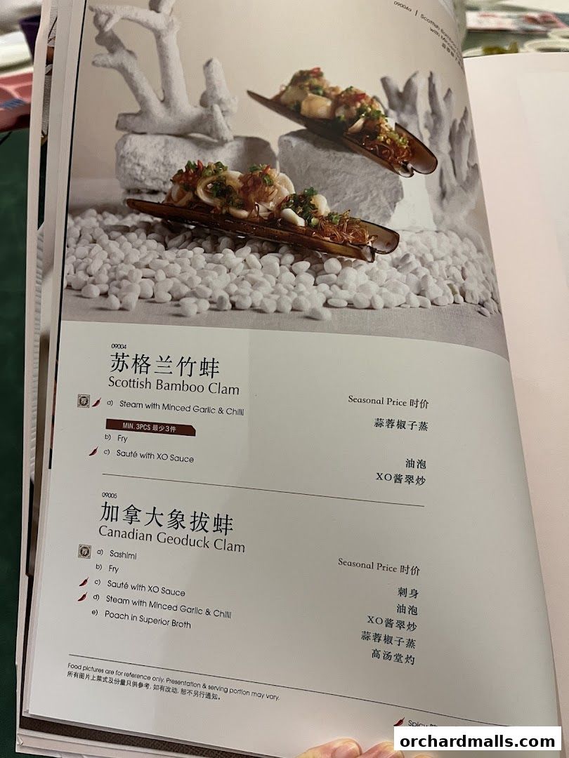 A menu page from Crystal Jade Palace featuring Scottish Bamboo Clam and Canadian Geoduck Clam dishes.