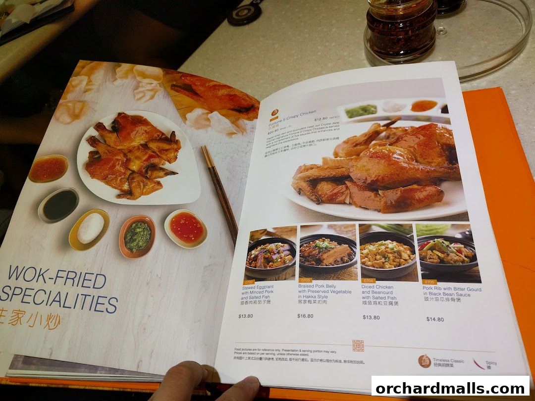 A menu page from Crystal Jade Palace featuring wok-fried specialties and crispy chicken.