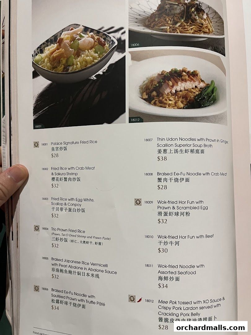A menu page from Crystal Jade Palace featuring various rice and noodle dishes with prices.
