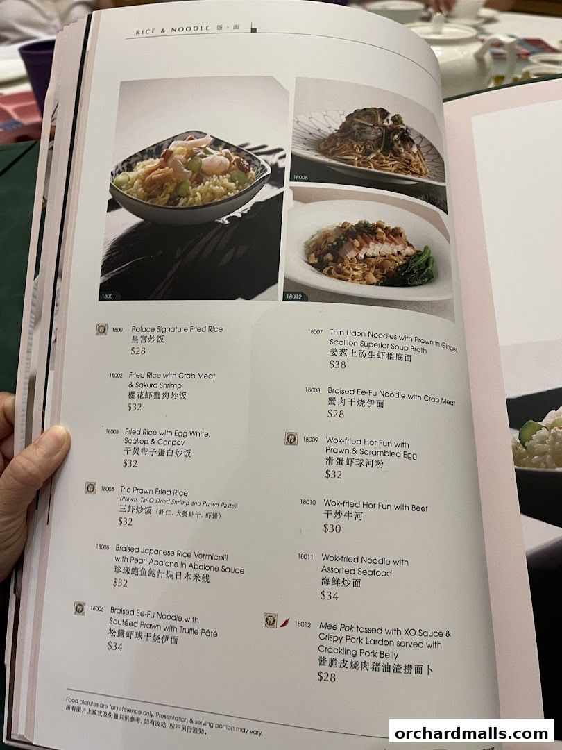 A menu page from Crystal Jade Palace featuring rice and noodle dishes with prices.