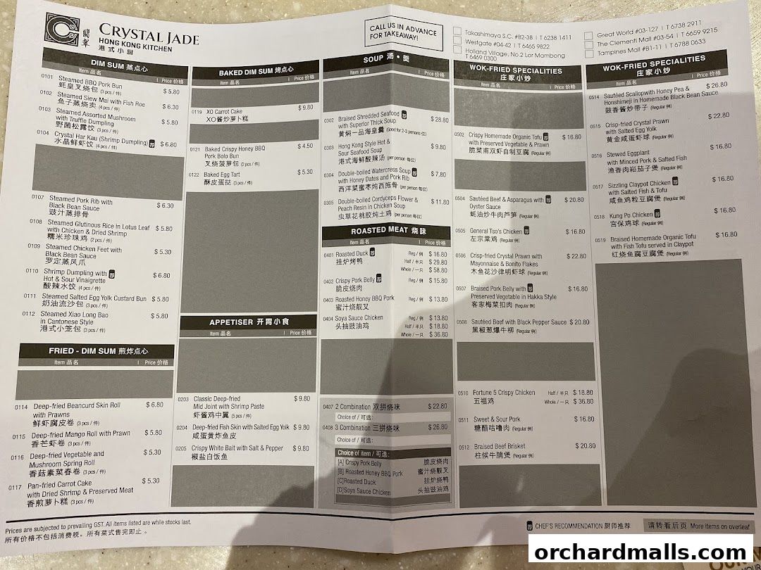 A menu from Crystal Jade Palace featuring Dim Sum, Wok-Fried Specialties, and Roasted Meats.