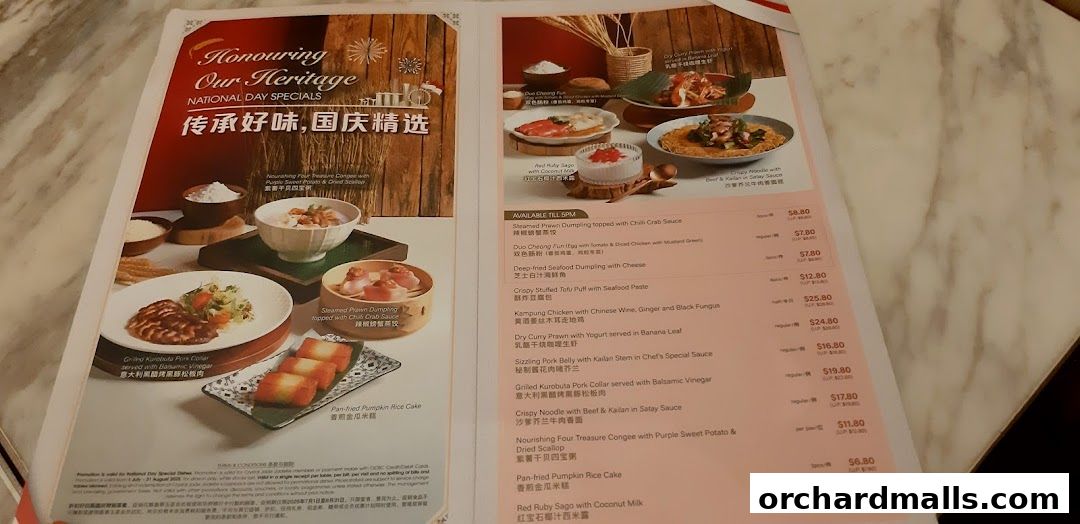 A menu page from Crystal Jade Palace featuring National Day specials with food images and prices.