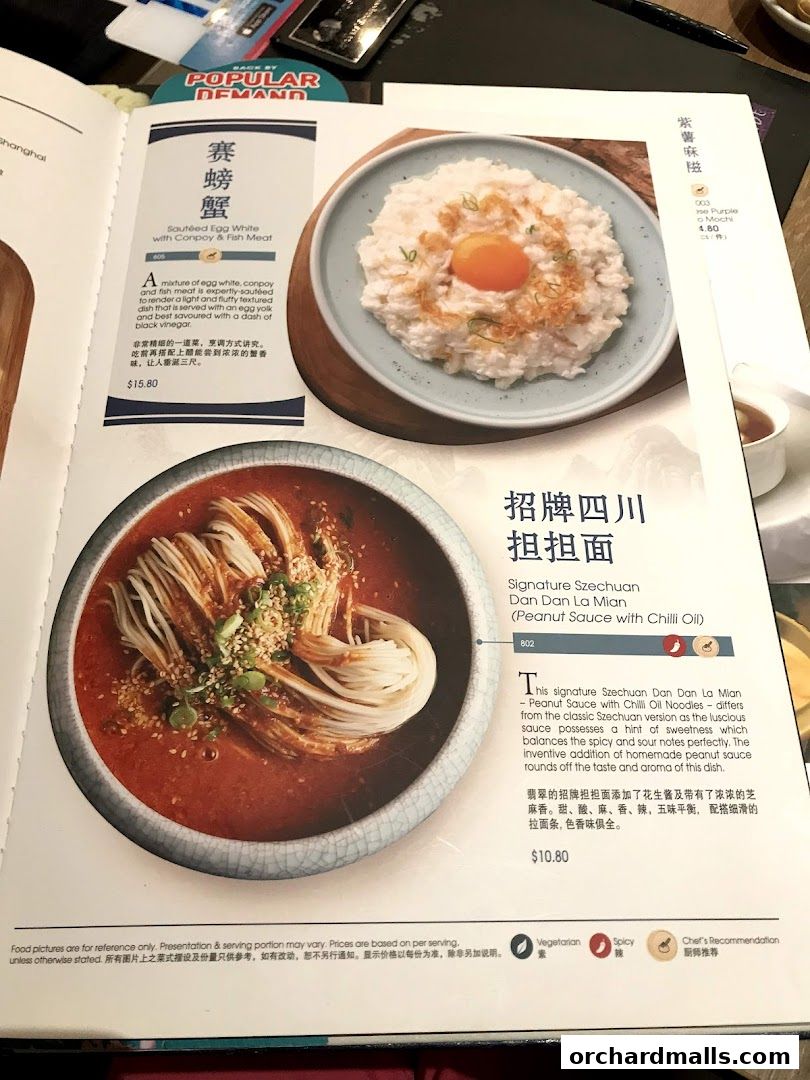 A menu page from Crystal Jade Palace featuring two signature dishes with descriptions and prices.