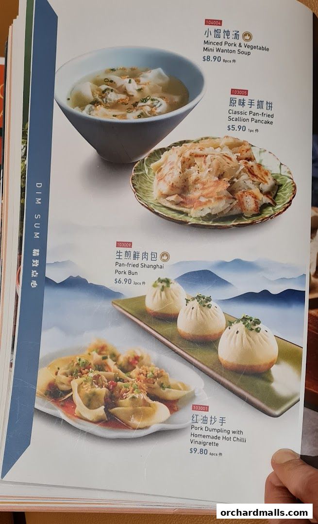 A menu page from Crystal Jade Palace featuring dim sum dishes like wonton soup and dumplings.