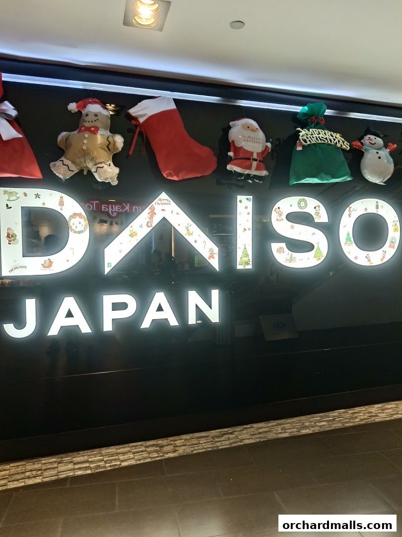 The DAISO JAPAN storefront is decorated with festive Christmas balloons and signage.