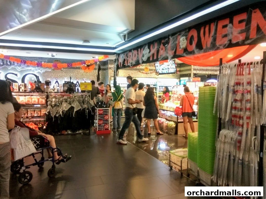 Interior of a Daiso store decorated for Halloween with festive banners and merchandise.