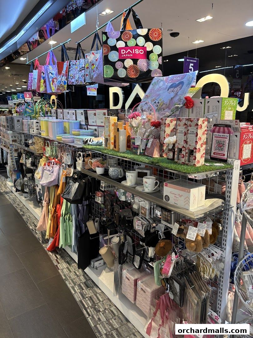 Interior view of a Daiso store showcasing a variety of colorful bags, storage boxes, and household items.