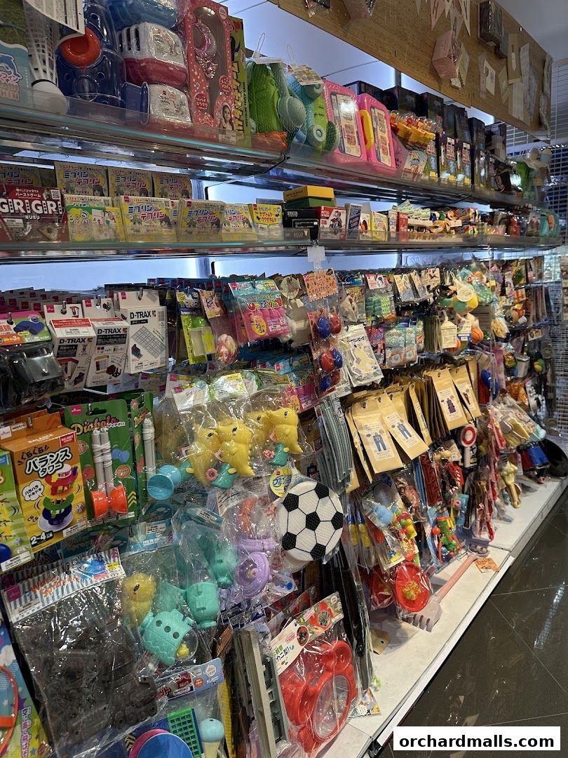Shelves filled with a variety of colorful toys and novelty items, including stuffed animals and games.