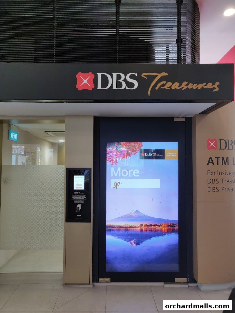 The entrance to DBS Treasures Ngee Ann City, featuring a digital display and ATM.