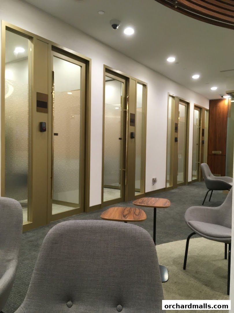 A waiting area with chairs and doors, likely for private consultations.