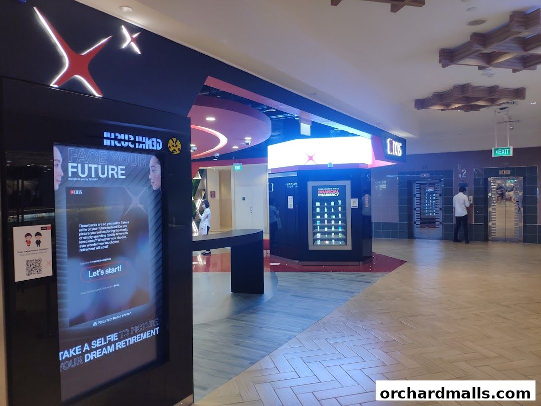 A digital display promotes DBS Bank's 'Face Your Future' campaign with a selfie option.