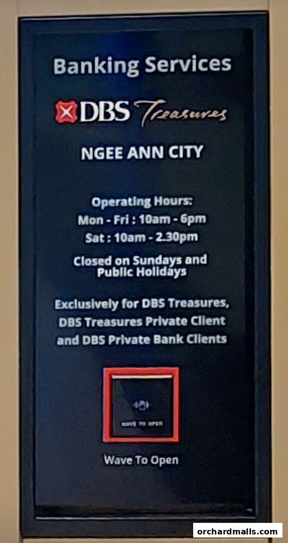 Sign for DBS Treasures Ngee Ann City banking services with operating hours.