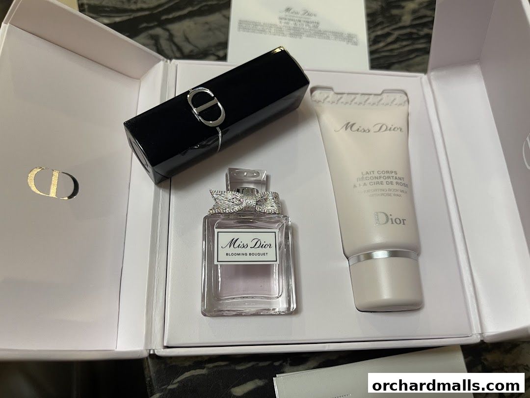 A Dior beauty gift set featuring Miss Dior perfume, lipstick, and body lotion.