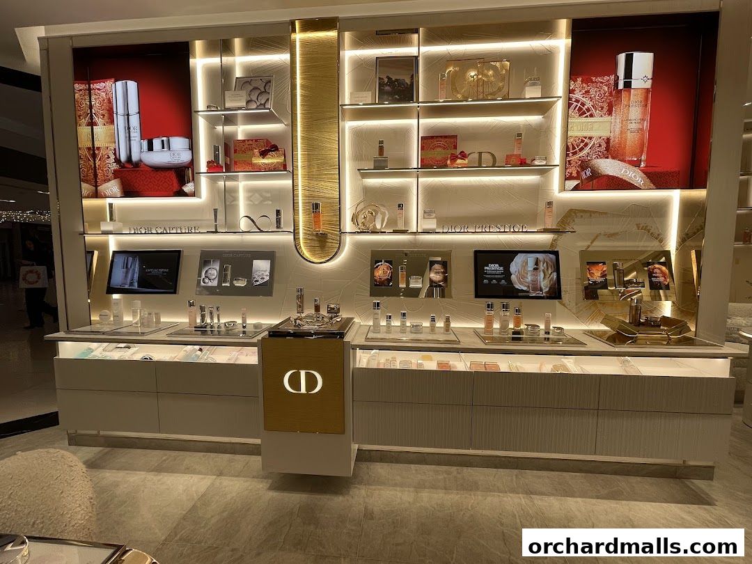 A well-lit Dior Beauty boutique display featuring skincare products and promotional screens.