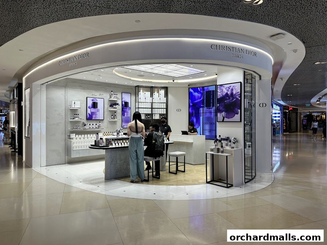 A Christian Dior boutique showcasing fragrances and beauty products with customers being served.