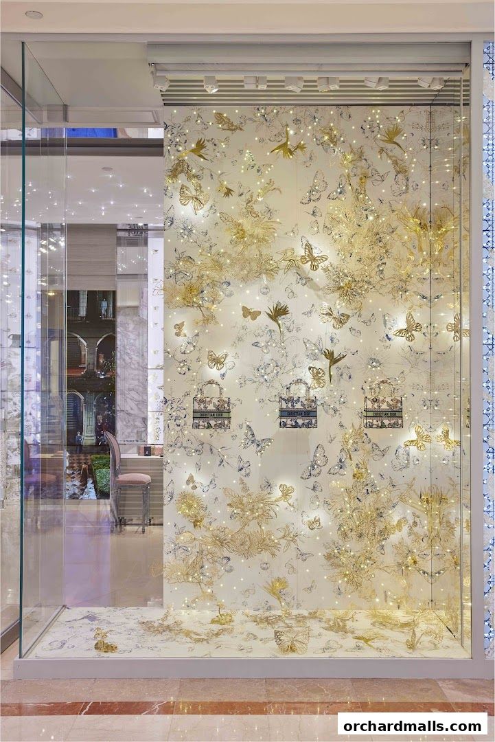 Dior Ngee Ann City shop window display with butterflies and floral motifs.