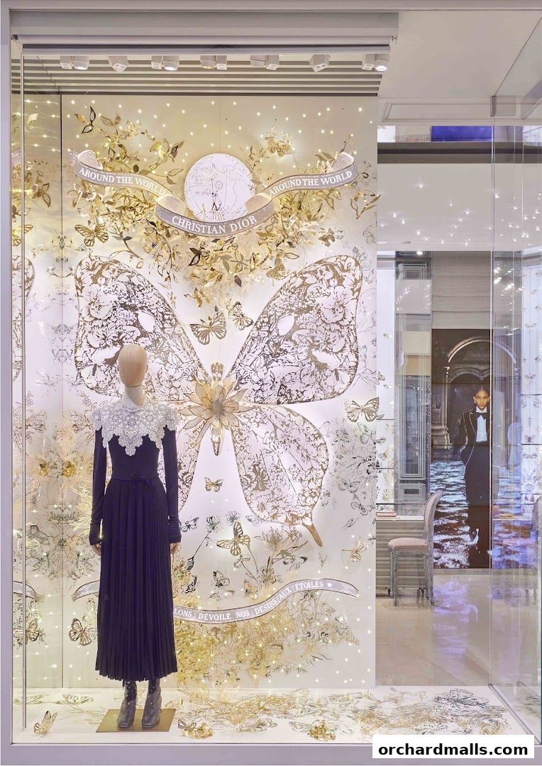 Dior Ngee Ann City shop window display featuring a mannequin and butterfly motifs.