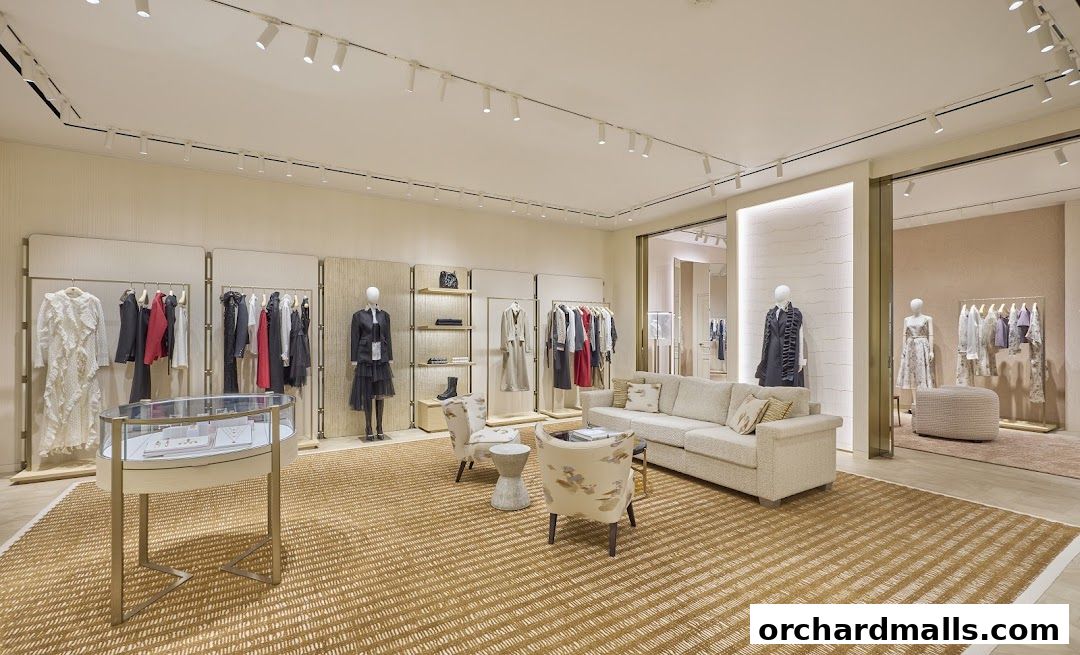 Interior view of a luxurious DIOR boutique showcasing clothing, accessories, and seating areas.