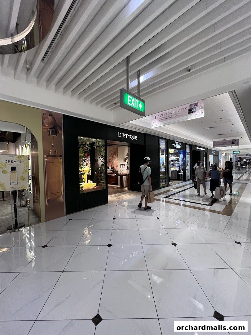 The Diptyque store entrance in a modern shopping mall with polished floors.