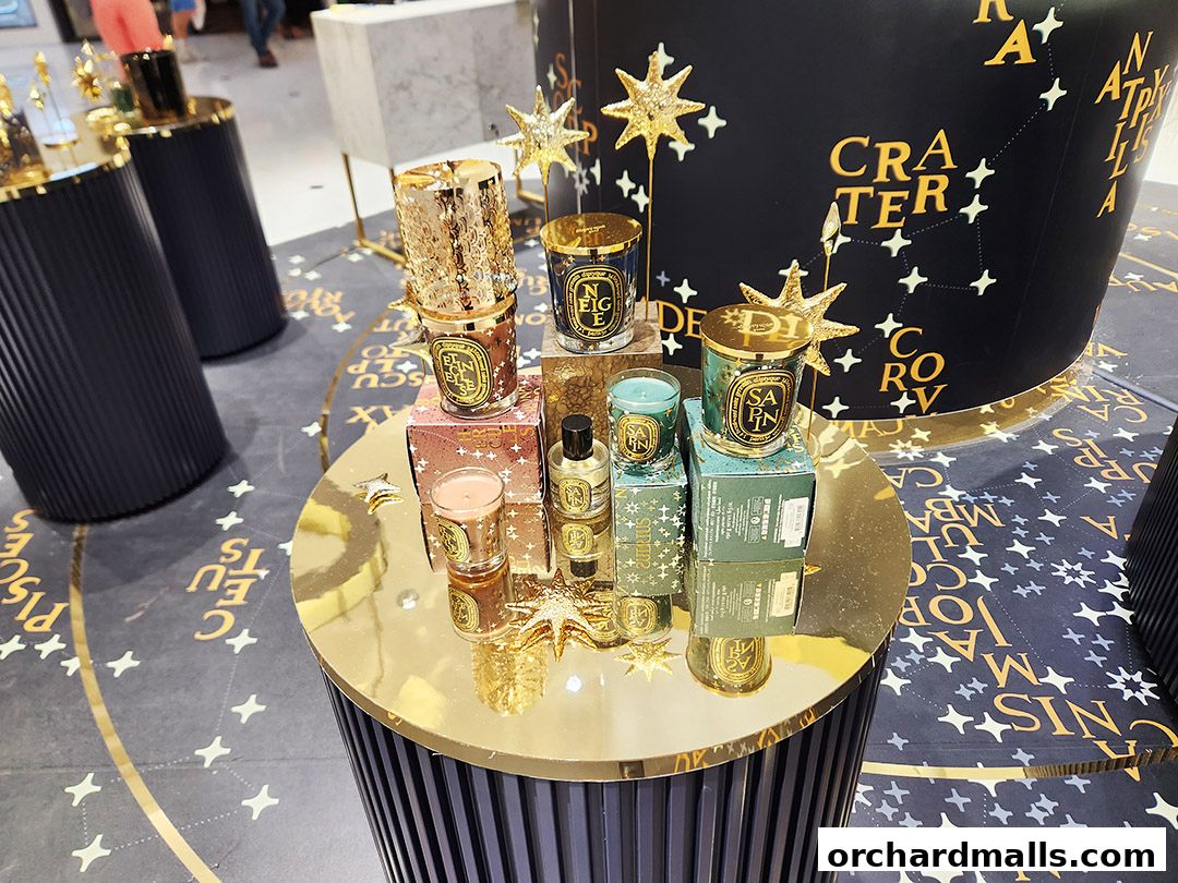 Diptyque Ngee Ann City display featuring luxury candles and constellation-themed decor.