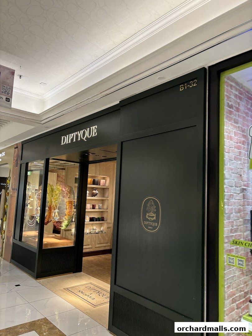 The elegant Diptyque shop front at Ngee Ann City, showcasing its luxurious products.