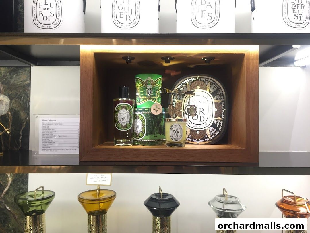 Diptyque Ngee Ann City shop interior showcasing luxury candles and home fragrances.
