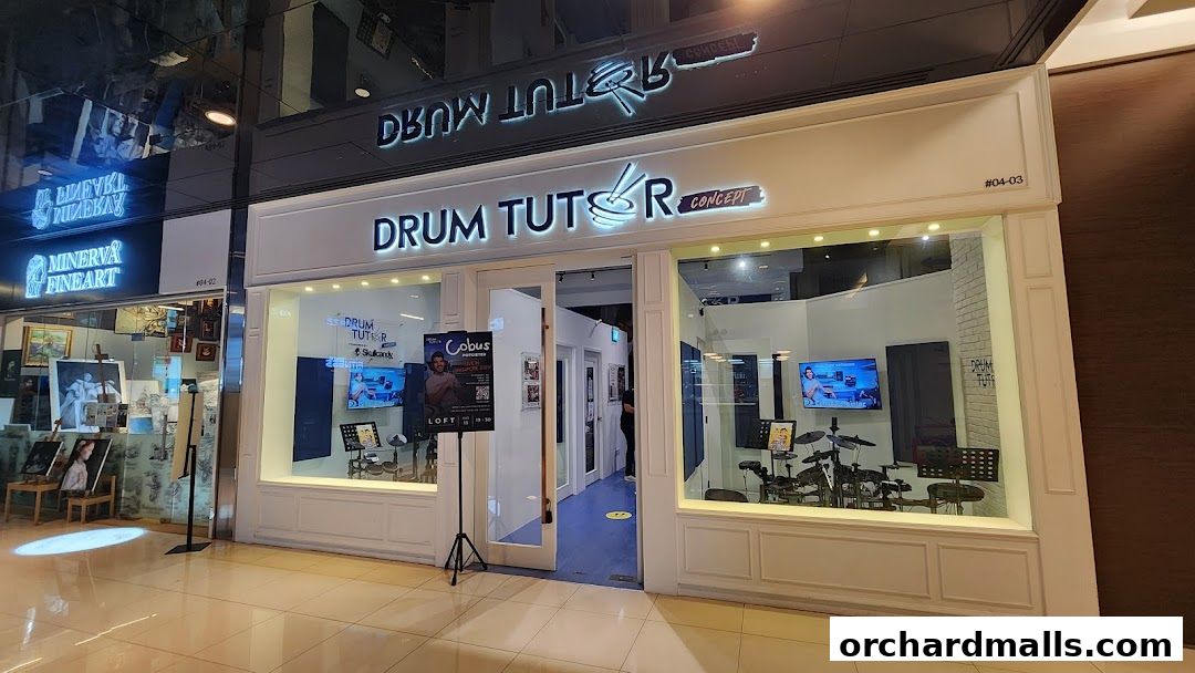 Exterior of Drum Tutor Singapore, a music school with drum kits visible inside.