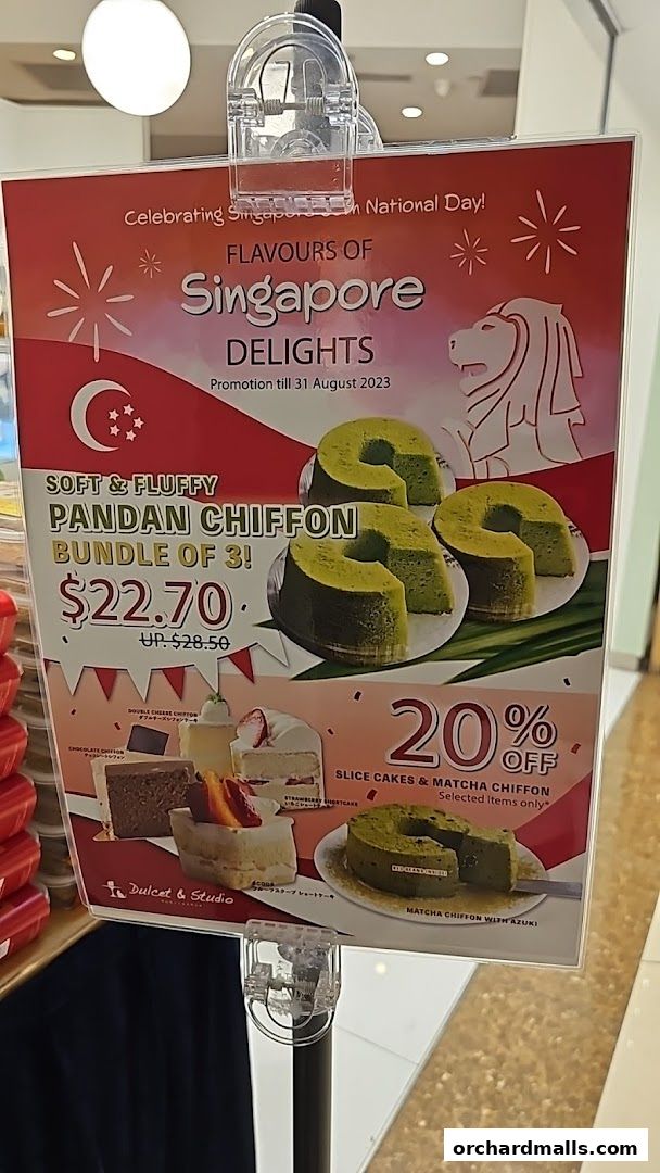 A promotional sign for Dulcet & Studio featuring Singaporean delights and cake offers.