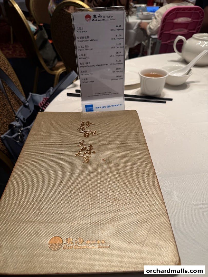 A menu from East Ocean Restaurant with various Chinese dishes and drinks listed.