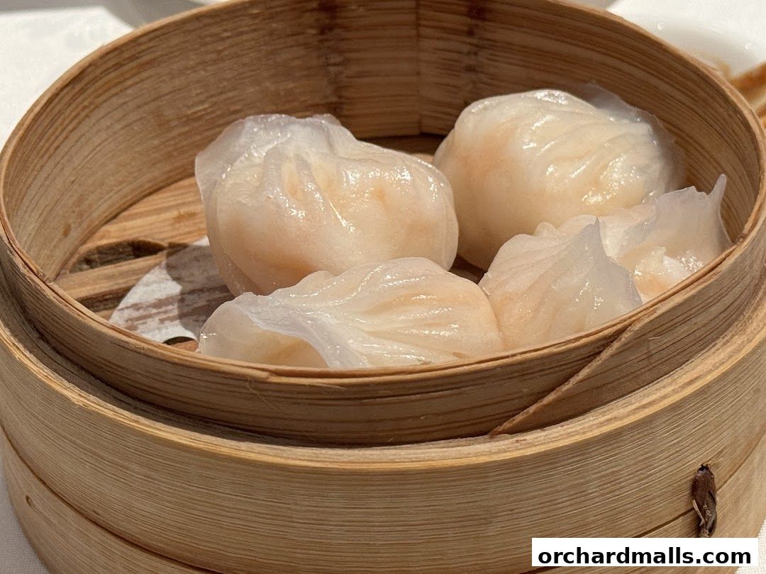 A close-up shot of steamed dumplings in a bamboo steamer basket.