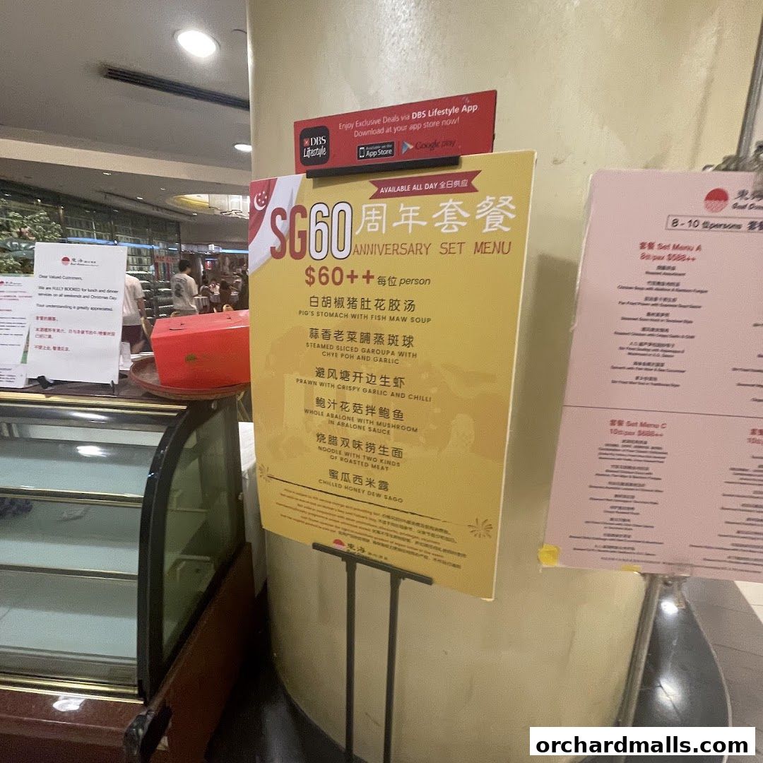 A yellow sign displays the SG60 Anniversary Set Menu with various dishes and prices.