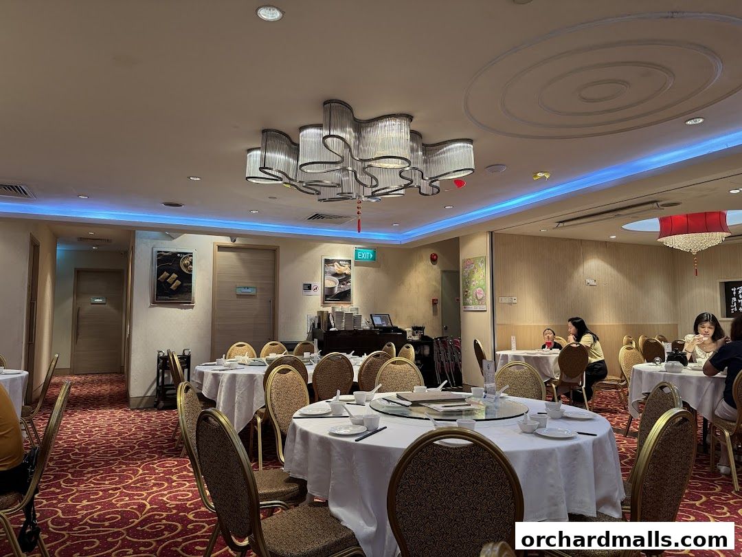 Interior view of East Ocean Restaurant with round tables set for dining.