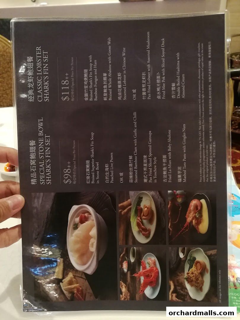 A menu from East Ocean Restaurant showcasing seafood and shark fin sets.