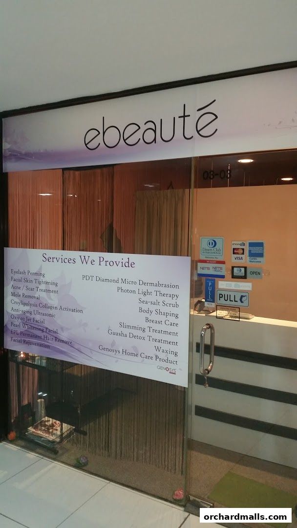 The entrance of Ebeaute, a beauty salon, displaying a list of services offered.