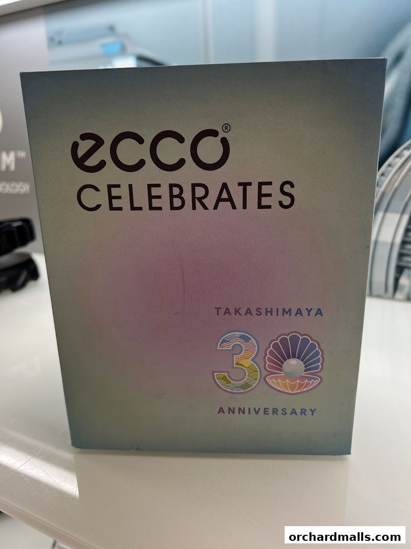 A box with 'ECCO CELEBRATES TAKASHIMAYA 30 ANNIVERSARY' printed on it.